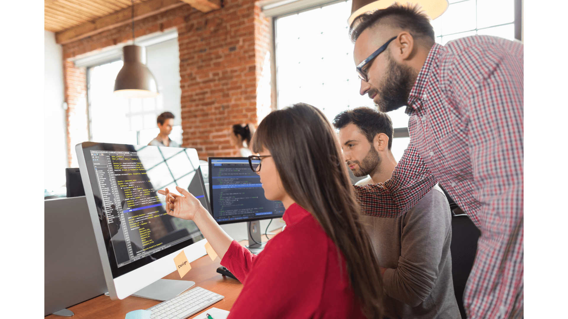 Software engineer coding on laptop